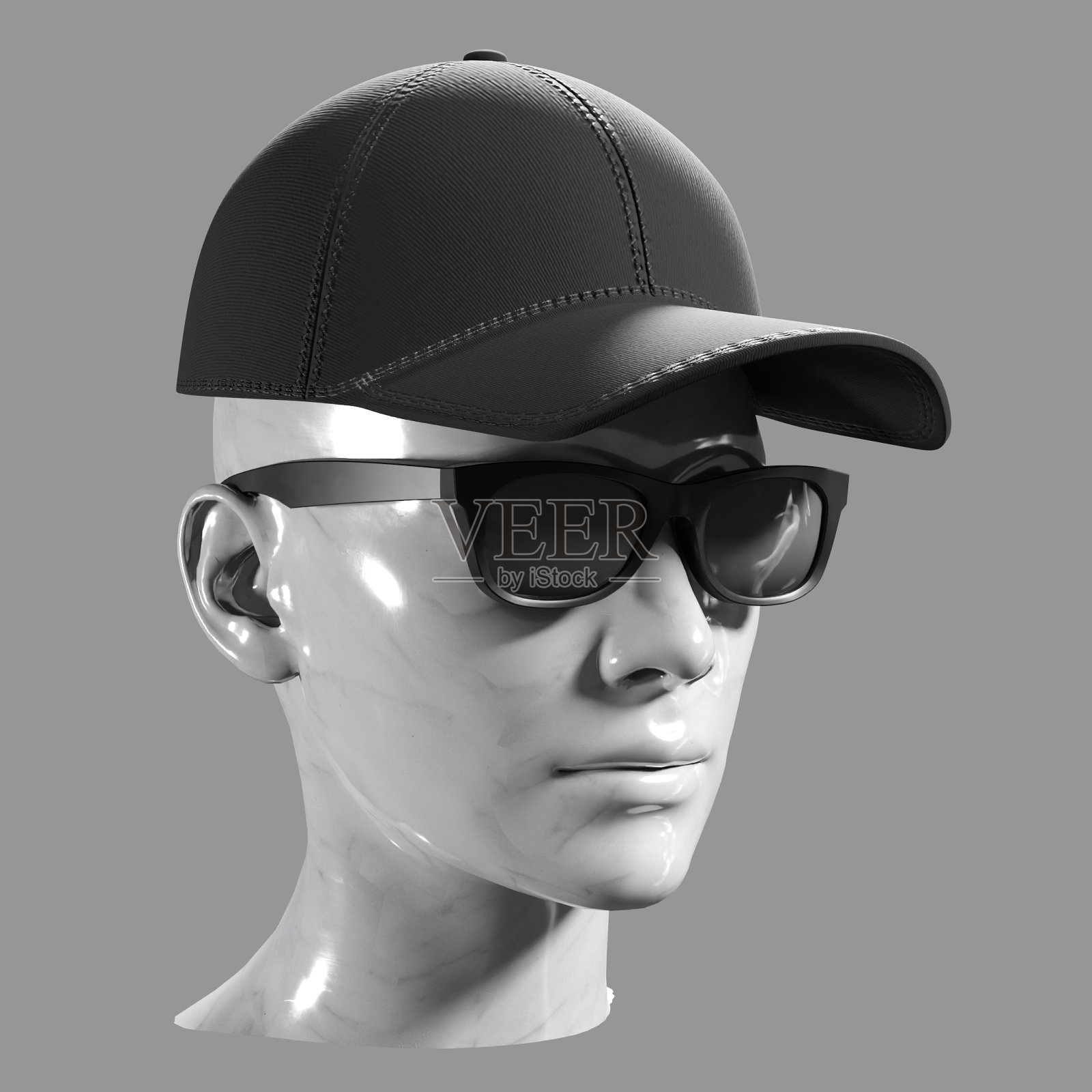 黑色棒球帽和太阳镜戴在大理石人体模型上。剪切路径照片摄影图片