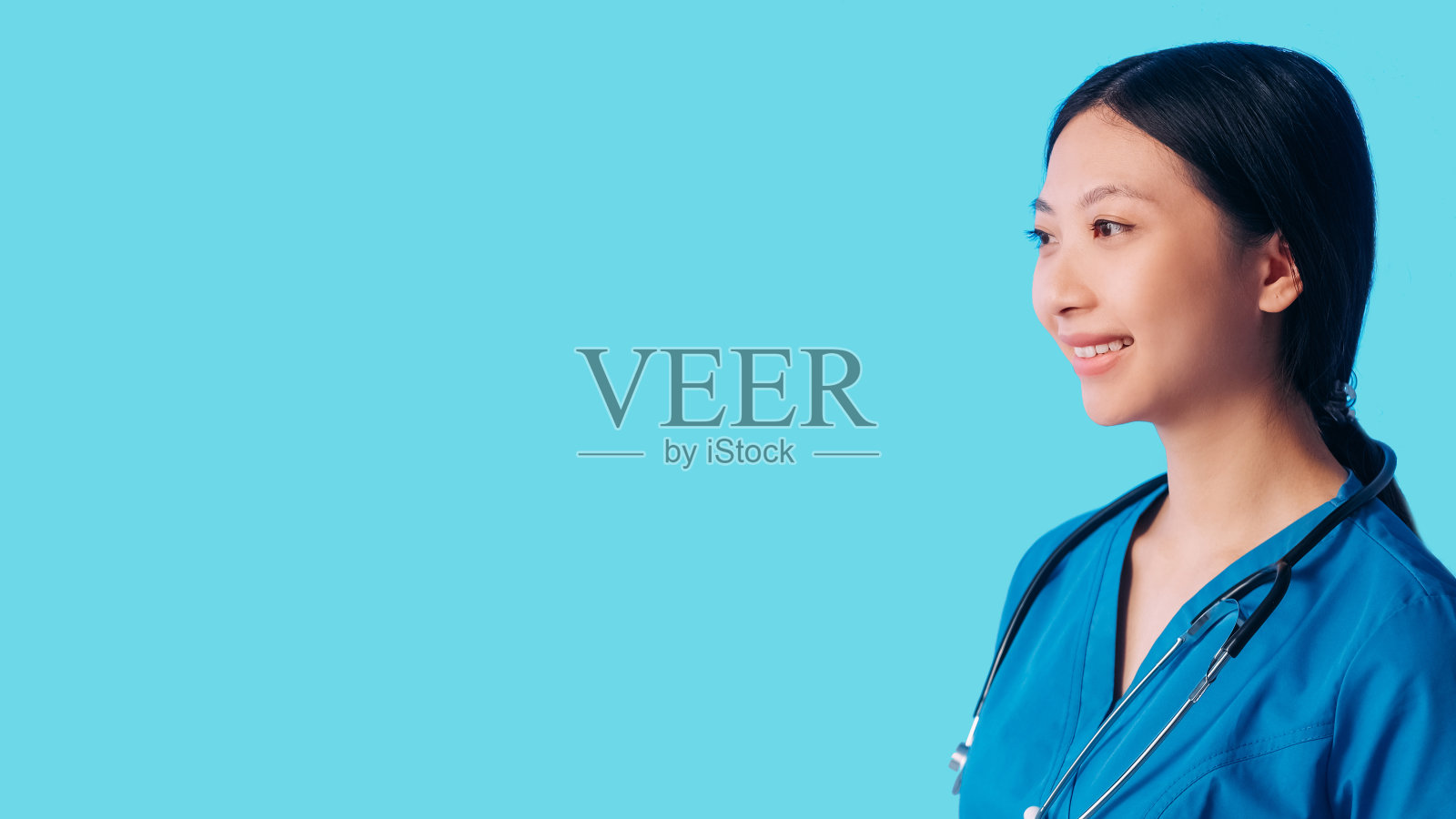 微笑的医生保健服务女士穿蓝衣服照片摄影图片