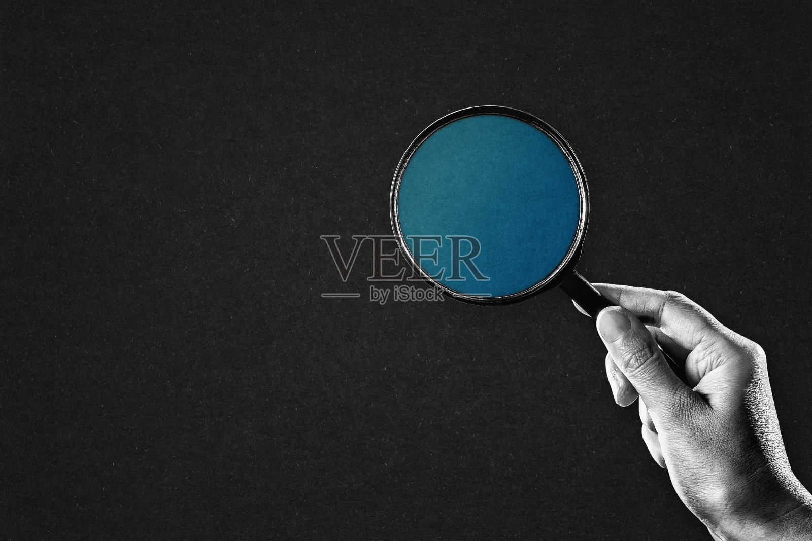 手持放大镜照片摄影图片