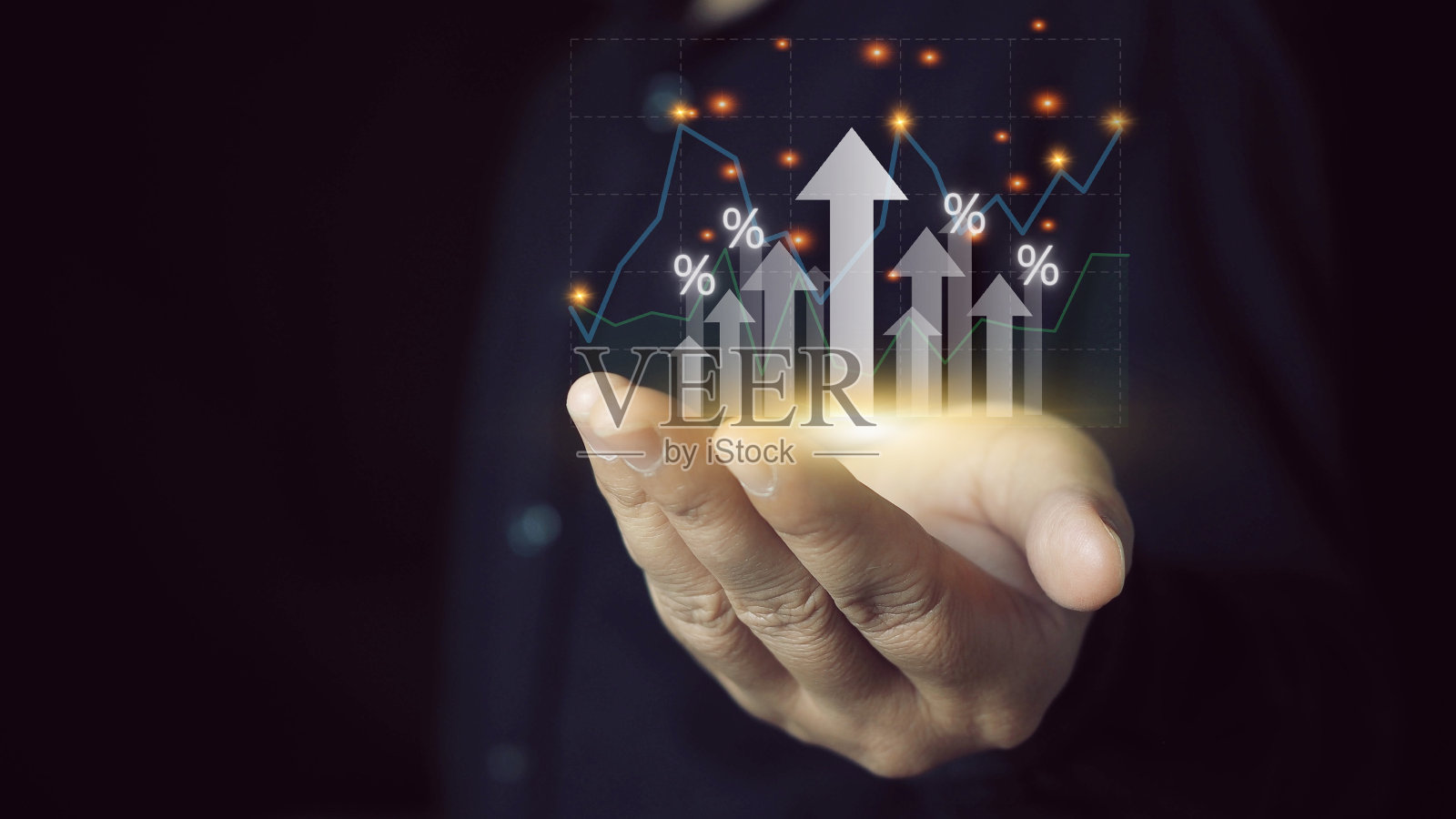 商人持有箭头图标和百分比与图表指标的投资增长。企业财务投资、业务增长、收入、营销和利润。利率和股息。照片摄影图片