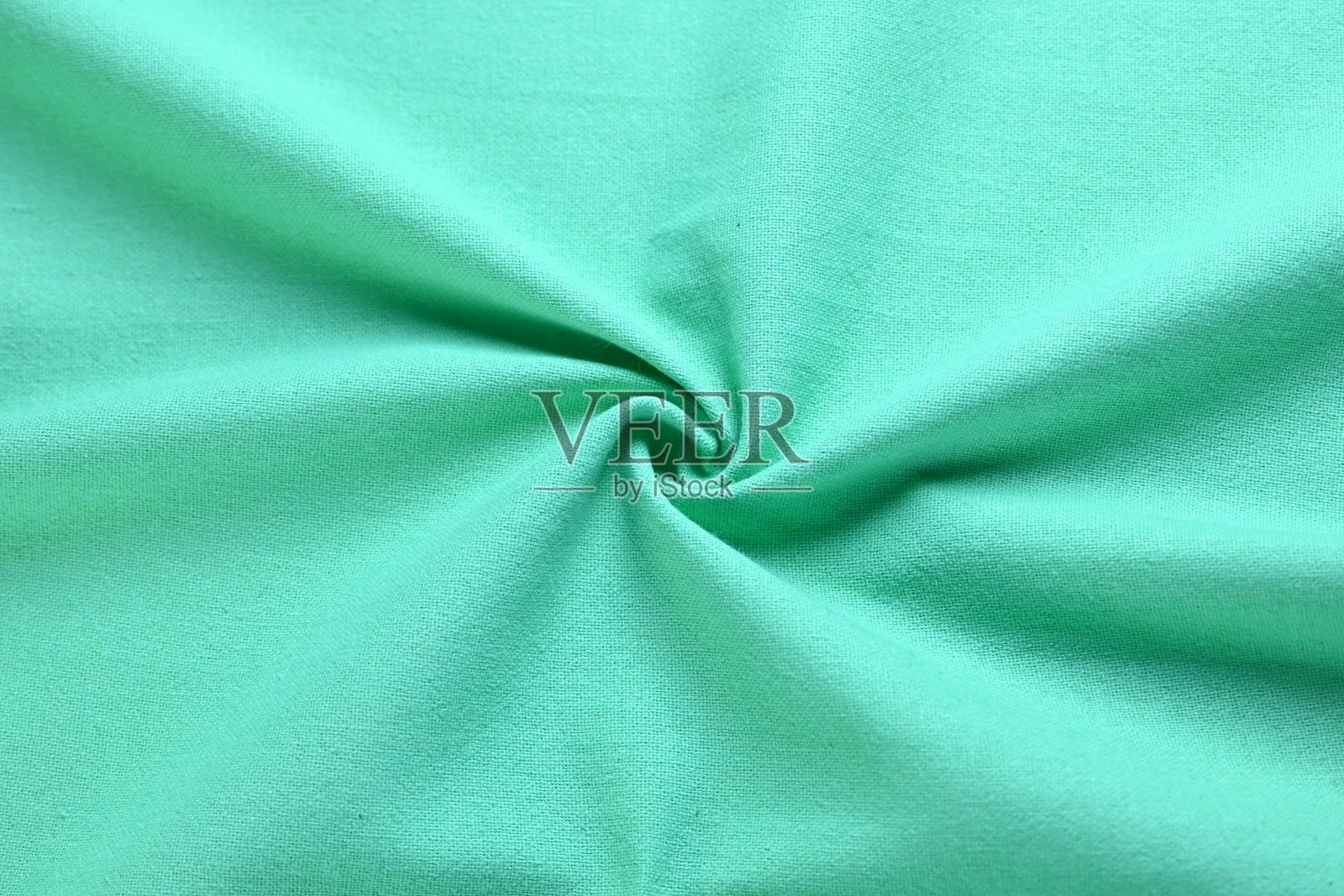 淡绿色薄荷色纹理的面料纺织，抽象形象为时尚布料设计的背景照片摄影图片