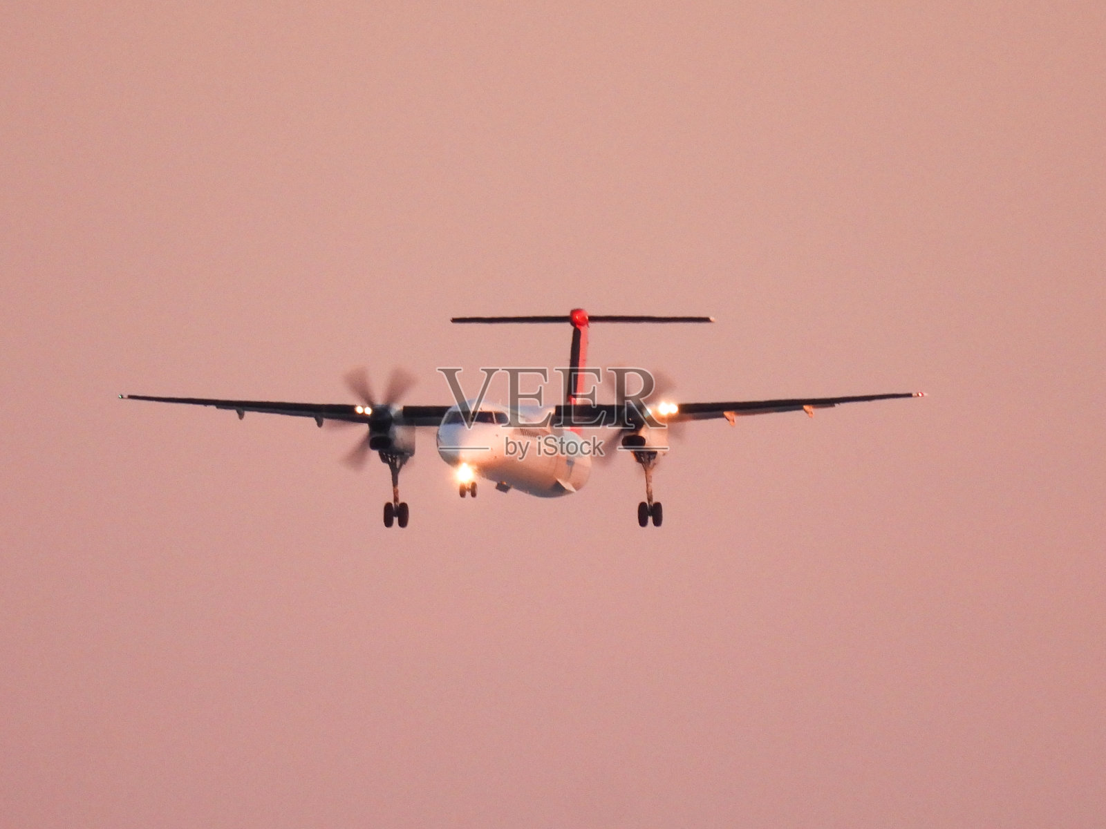 澳洲航空Dash 8粉色日落照片摄影图片