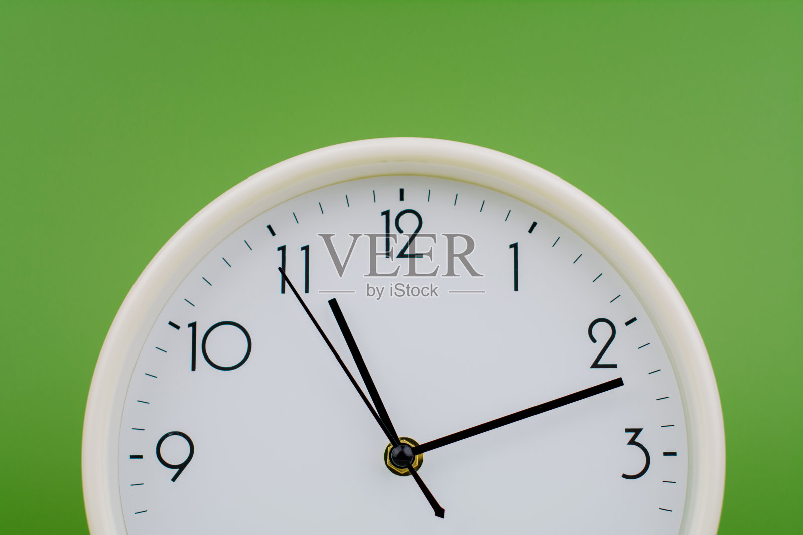 时间和时间的规律，工作的极限，静止的手，工作室摄影，时间的概念。照片摄影图片