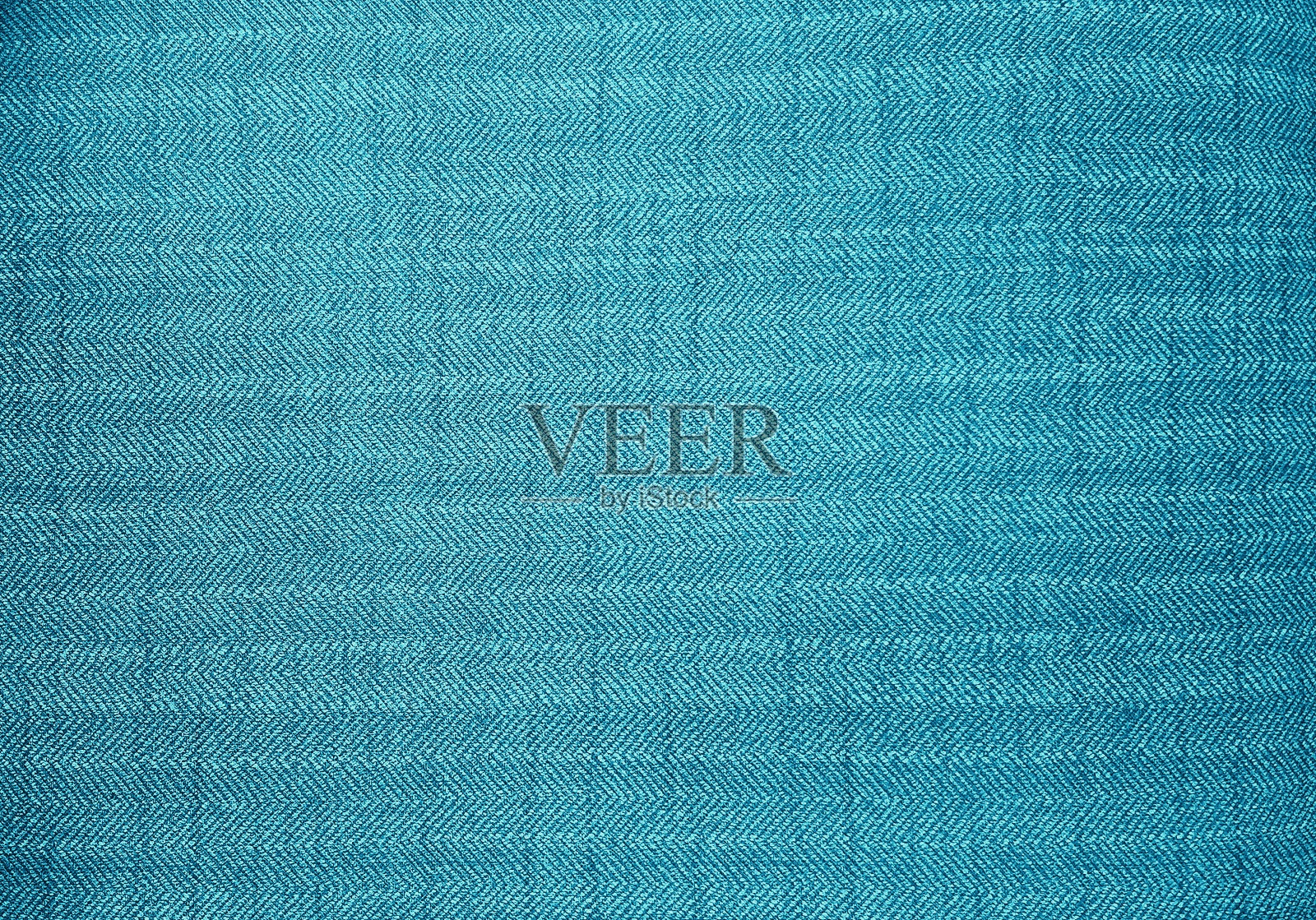 近距离观察蓝色面料的纹理。织物人字形、之字形、纹样。青色室内装潢或帷幔抽象纺织织物为设计背景。照片摄影图片