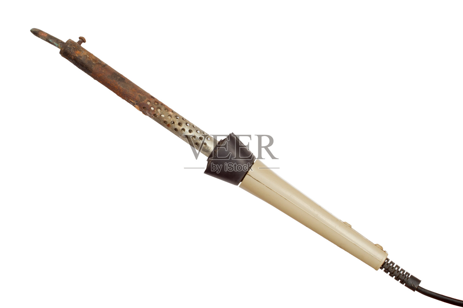 旧电烙铁隔离在一个白色的背景。照片摄影图片