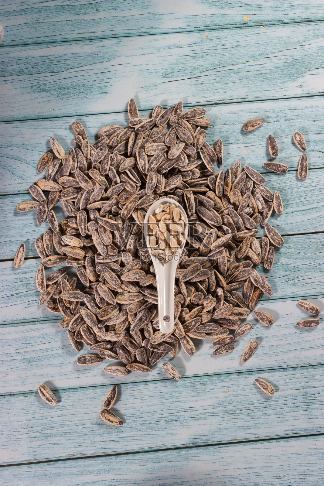 放松时间:葵花籽享受照片摄影图片