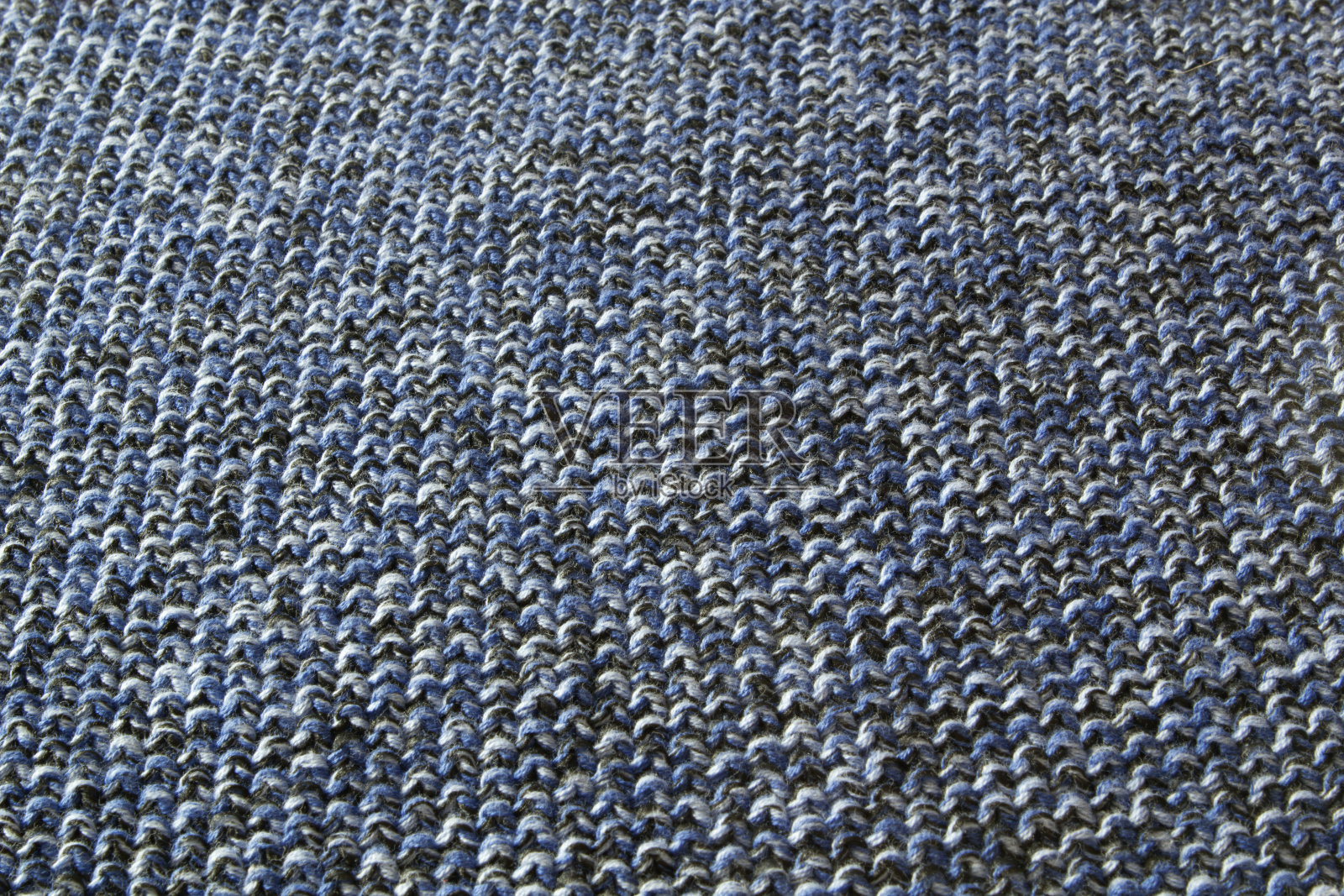 蓝色底色的针织毛织品的质地照片摄影图片