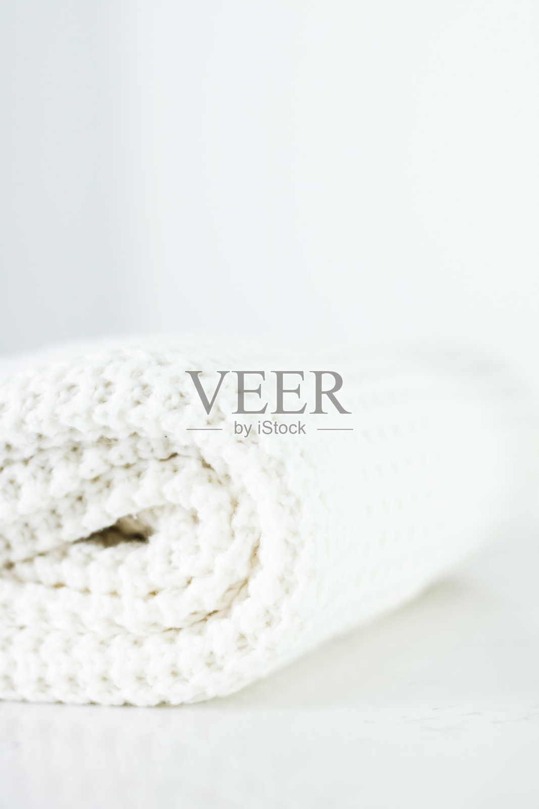 保暖的针织衣服，柔软洁白照片摄影图片