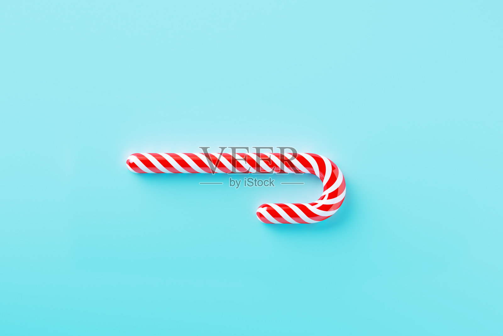 圣诞糖果在蓝色的背景照片摄影图片