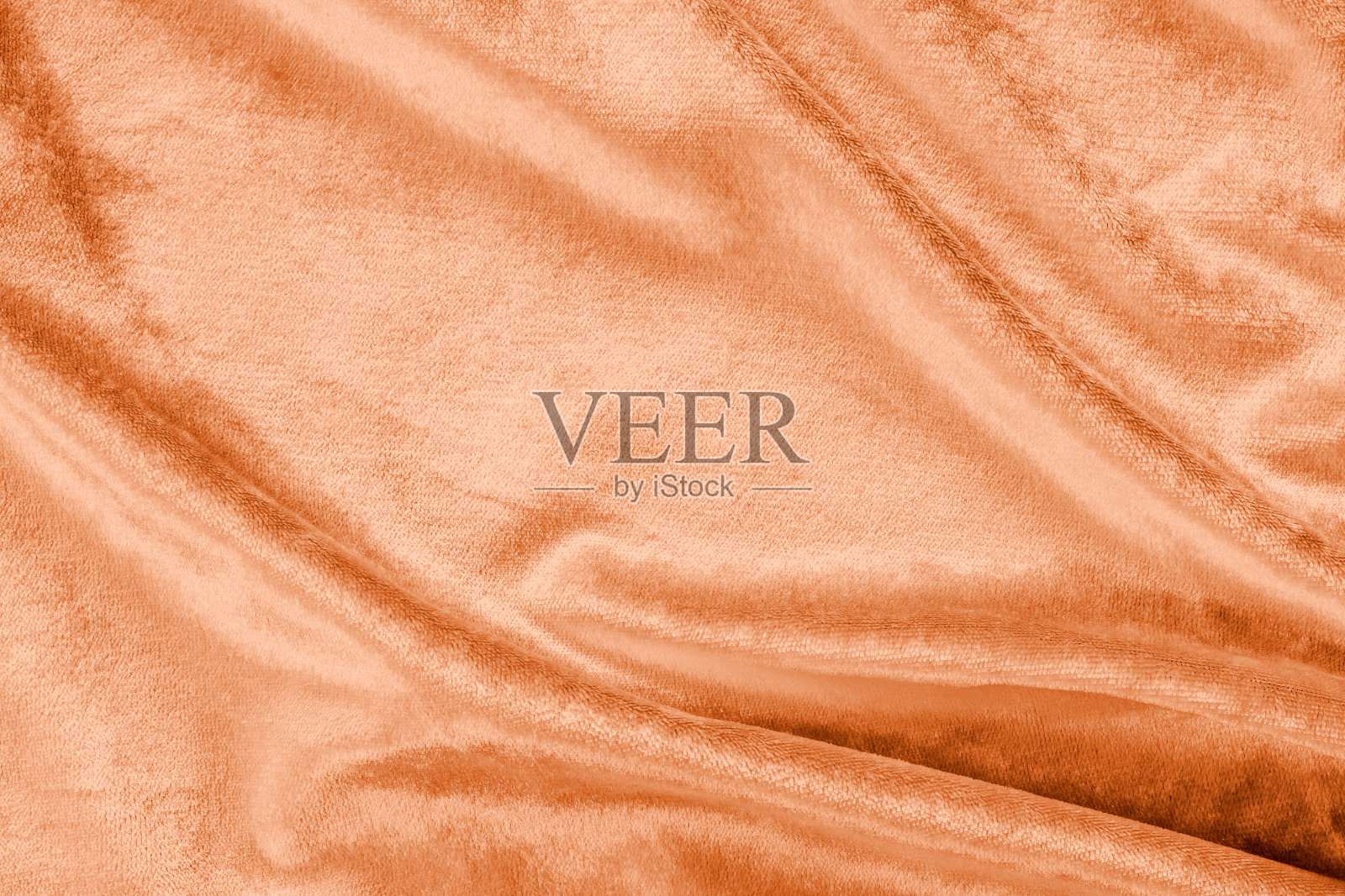 铜金丝绒底色或金橙琥珀色丝绒法兰绒质地，由棉或羊毛用柔软蓬松的天鹅绒缎织物制成，布料呈金属色照片摄影图片