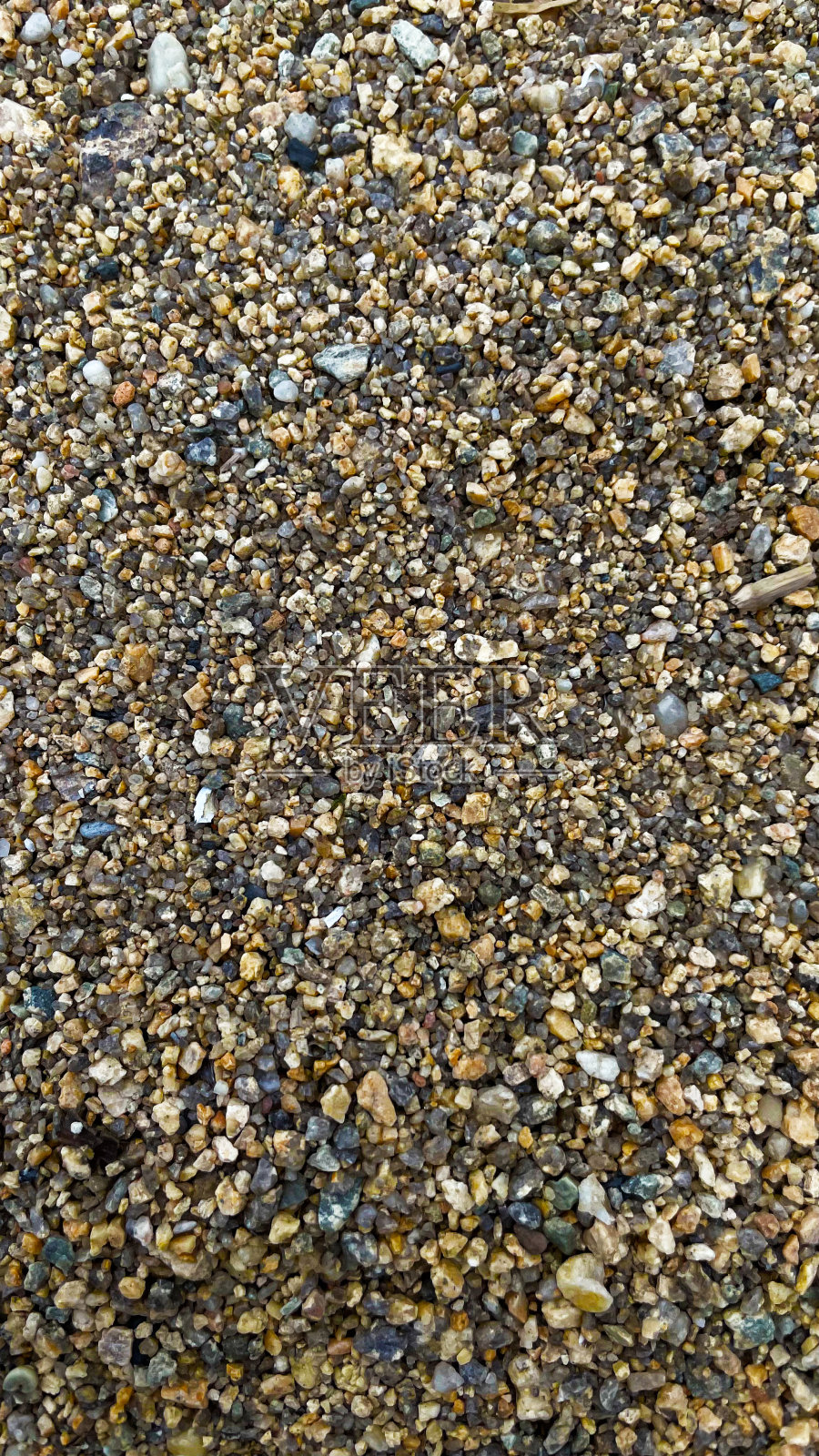 质地的黄色沙子与小鹅卵石。砂模式照片摄影图片