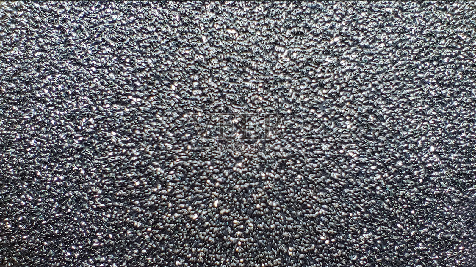 微距照片辊的砂纸纹理。抽象的背景或纹理。设计空白照片摄影图片