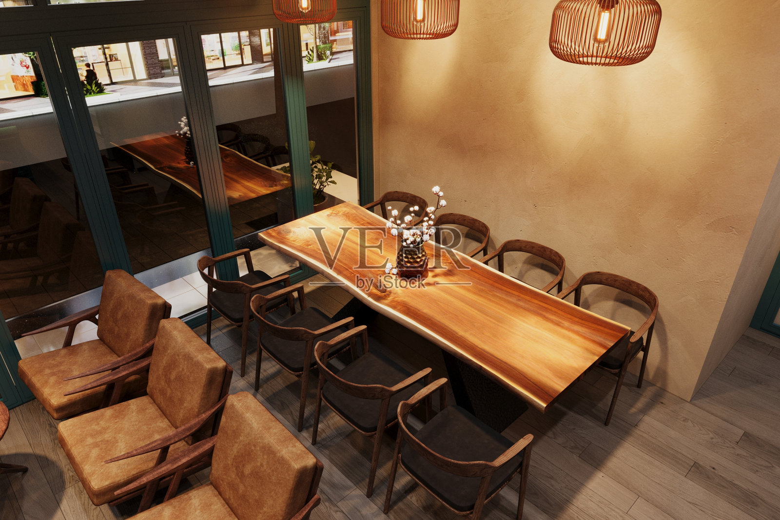 一个舒适的现代餐厅的内部，有椅子、桌子、鲜花和灯光。照片摄影图片