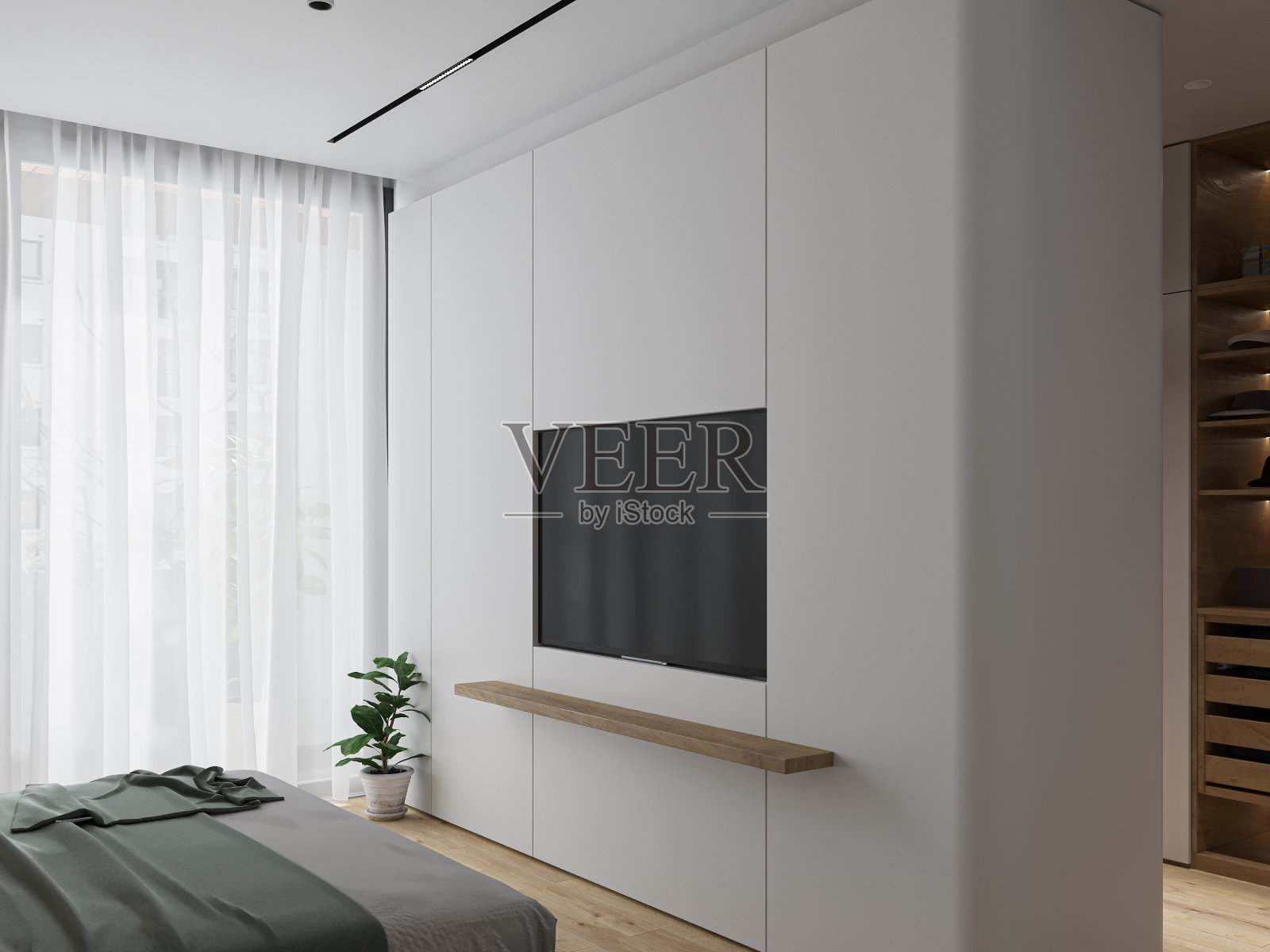 电视安装与智能电视旁边的窗口和床前。照片摄影图片