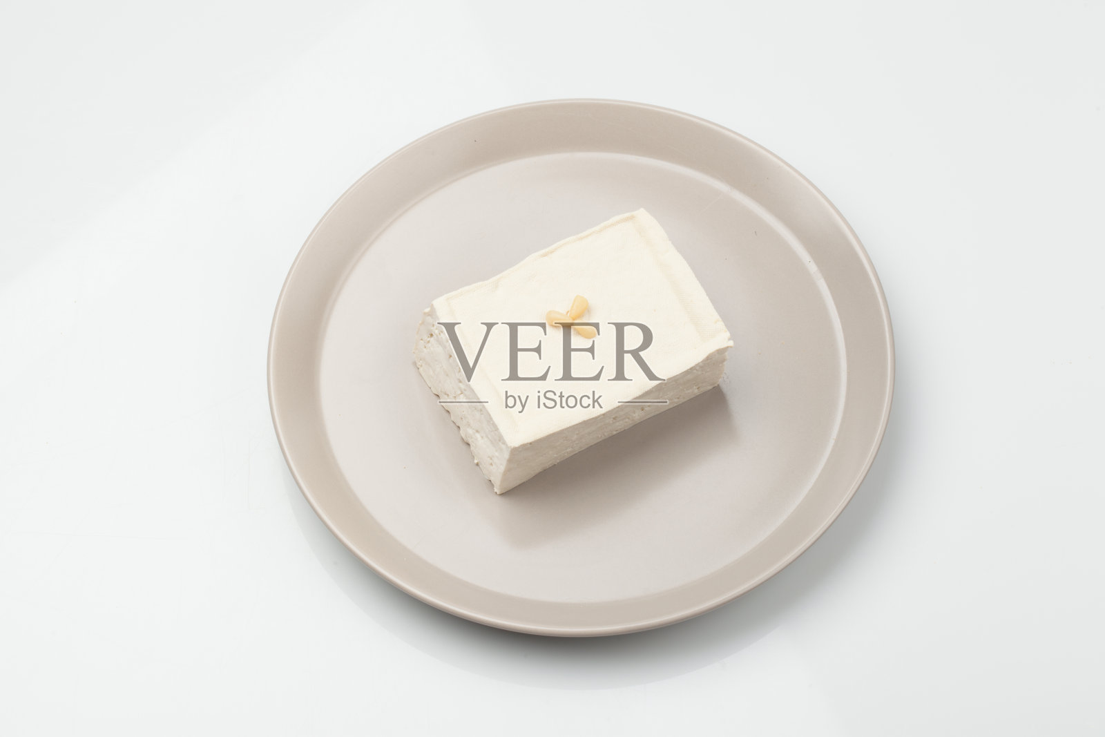 豆腐是由大豆制成的食物之一。照片摄影图片