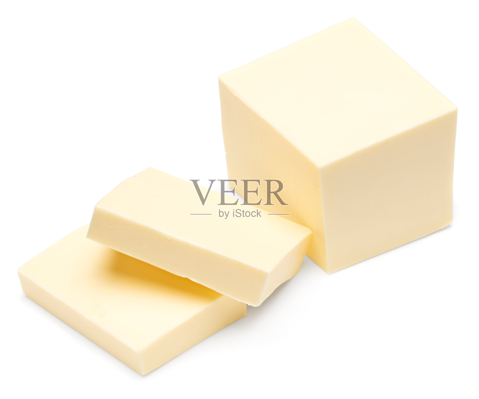 一块块黄油孤立在白色的背景上。剪切路径照片摄影图片