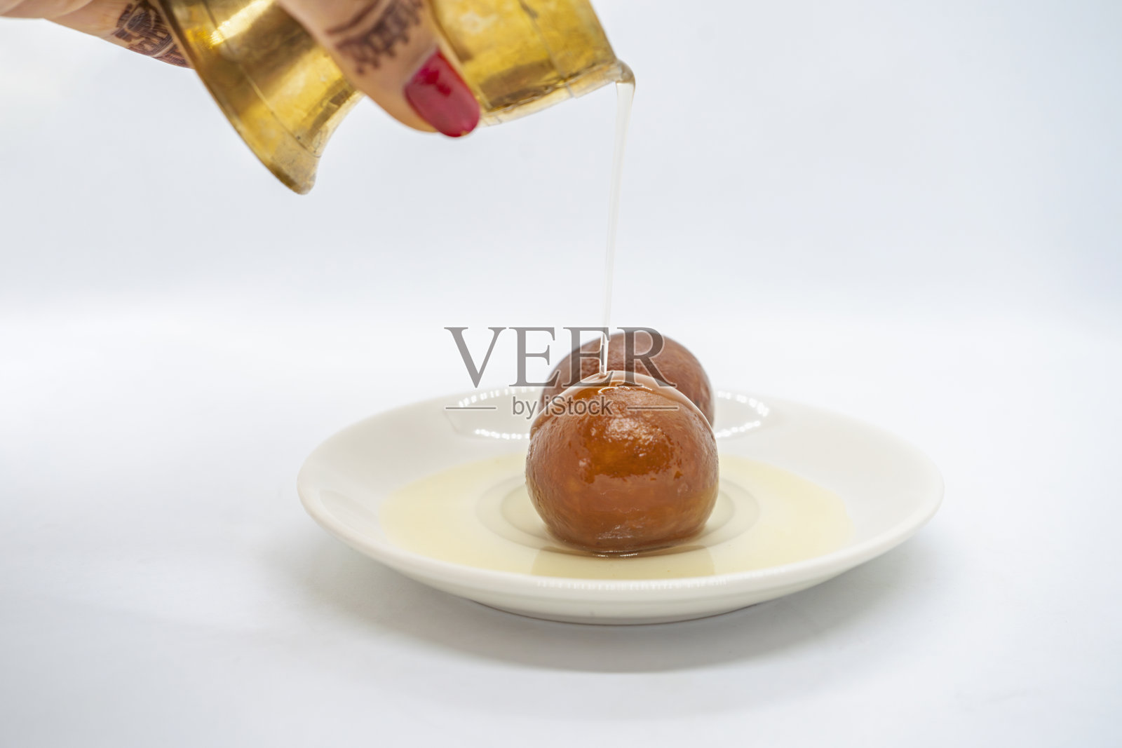 印度排灯节仪式上的一盘古拉·贾蒙·拉尔·莫汉糖果照片摄影图片