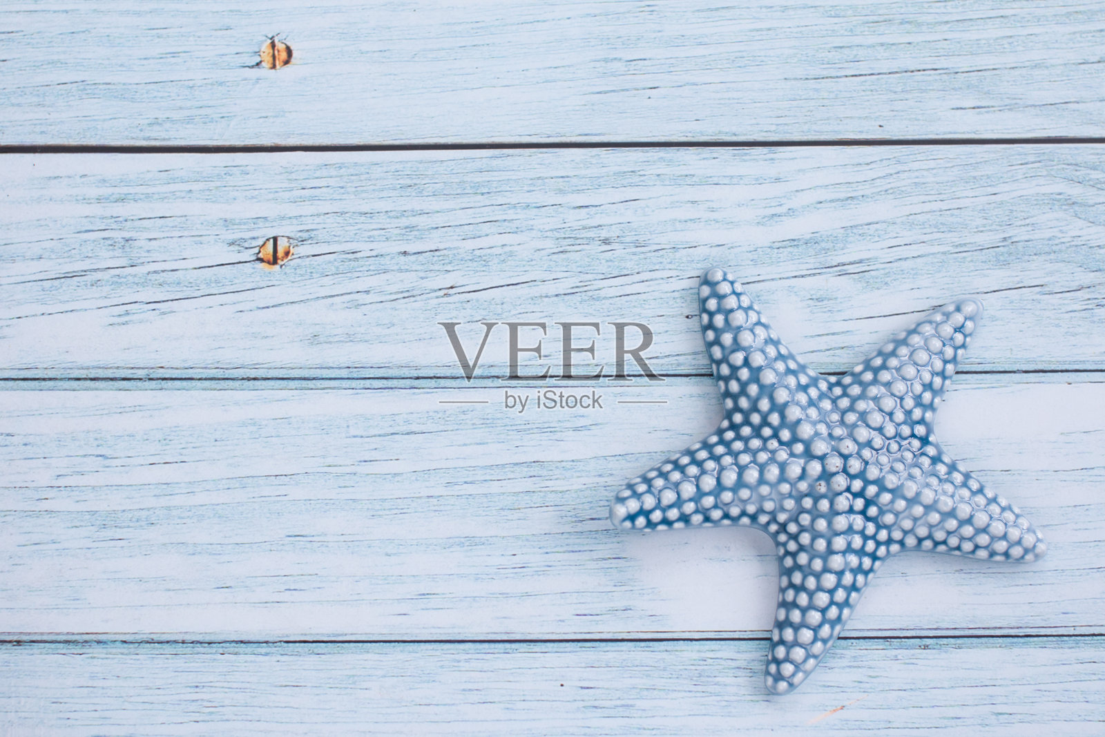 背景是海星。度假留下的热带纪念品照片摄影图片