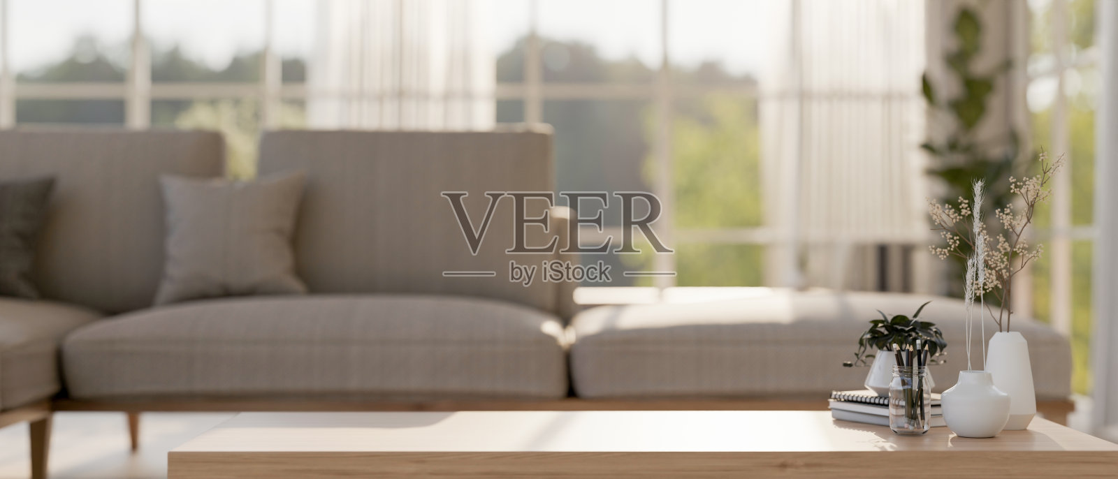 在当代斯堪的纳维亚客厅的木制咖啡桌上展示产品的空间。照片摄影图片