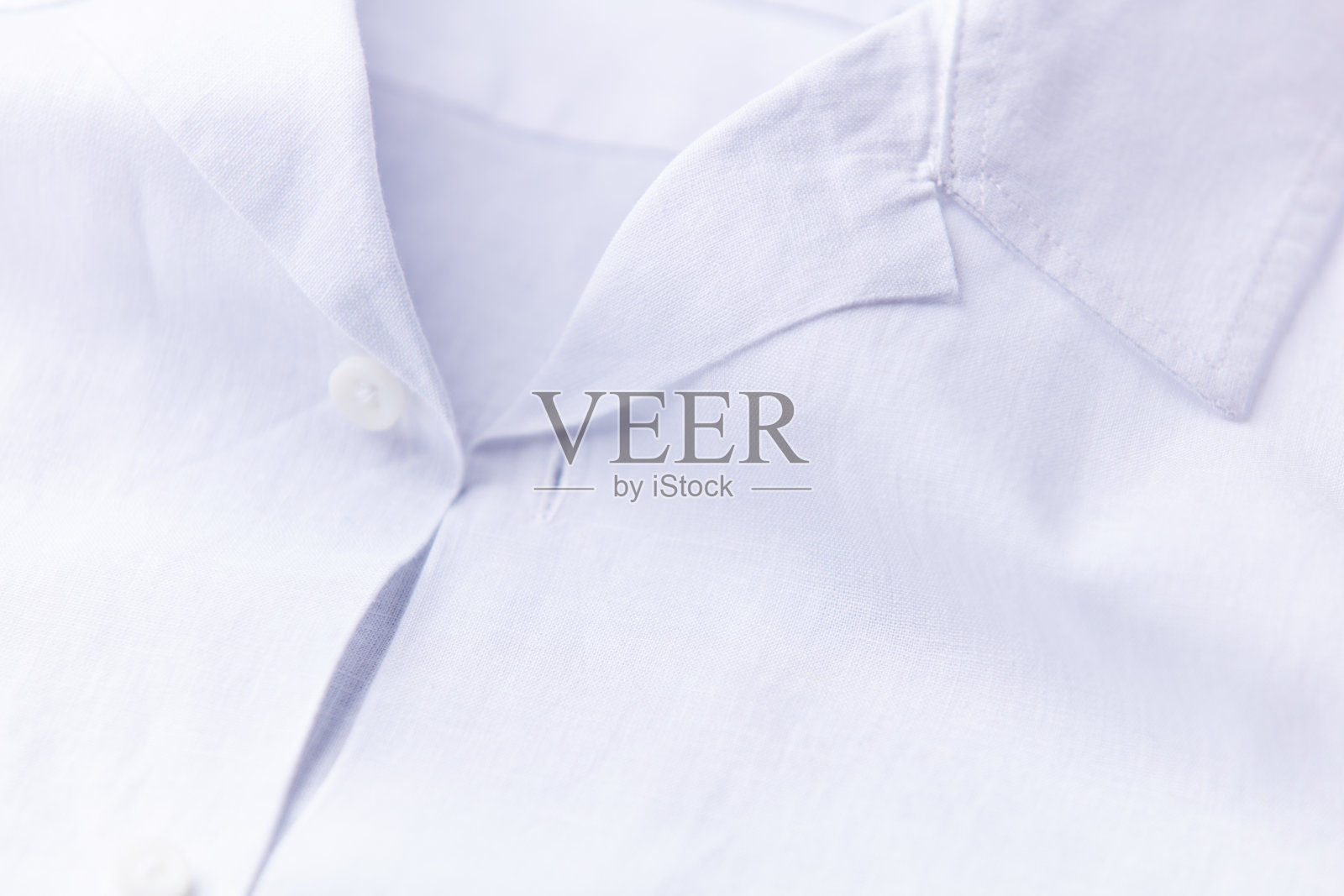 白色男士衬衫的特写。照片摄影图片