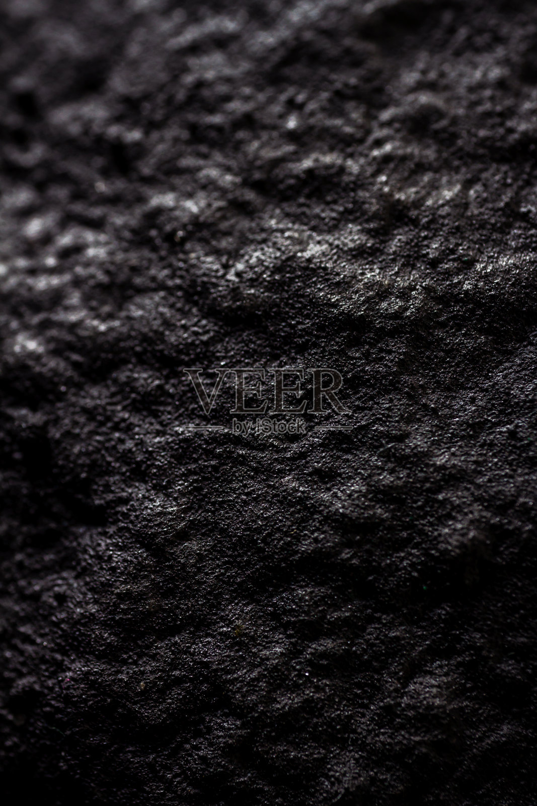 极端的近距离绘制在黑色手工纸糊与结构和粗糙的纹理。照片摄影图片