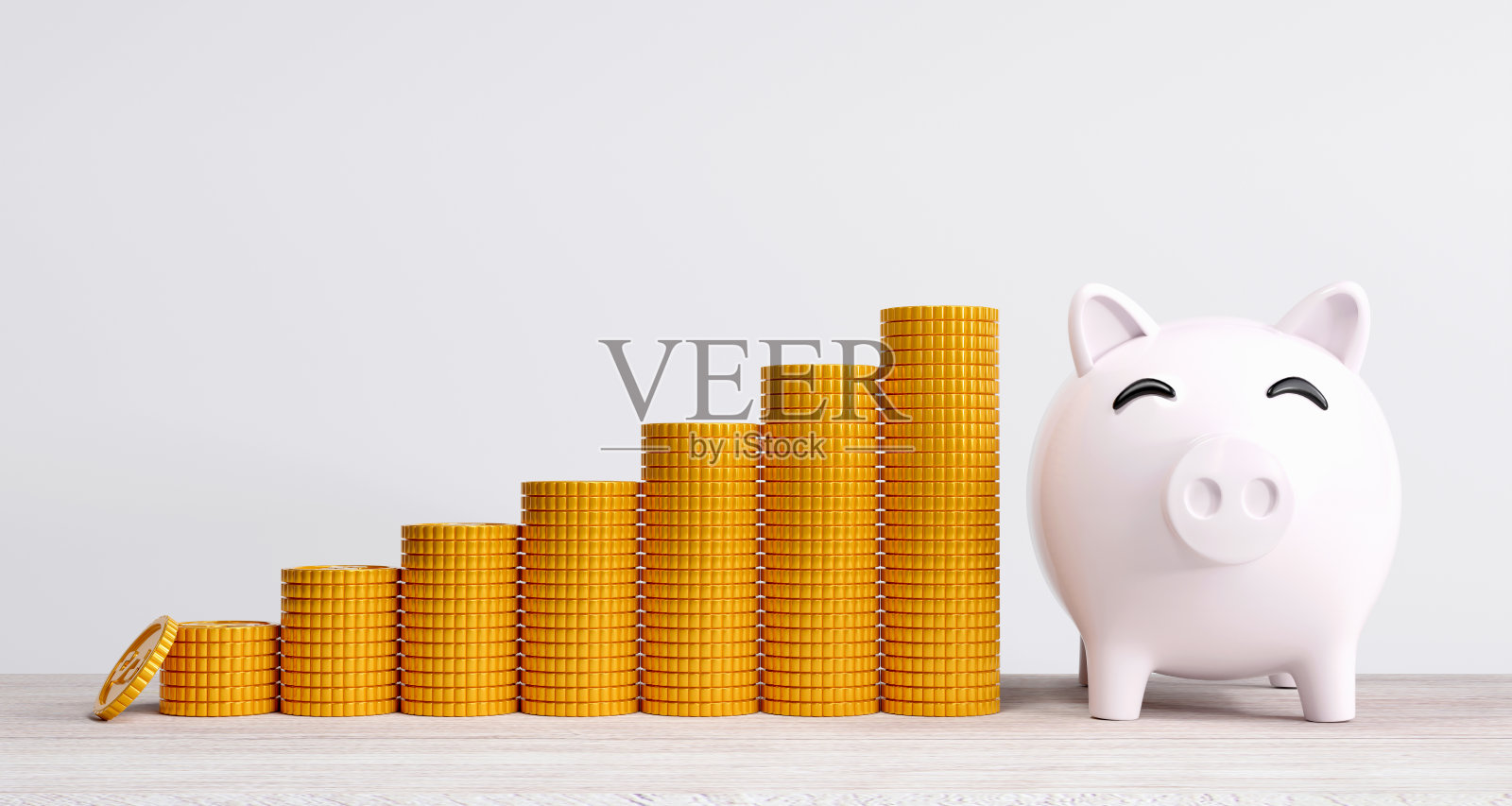 白色的储蓄罐，金币一排一排地堆放着。照片摄影图片