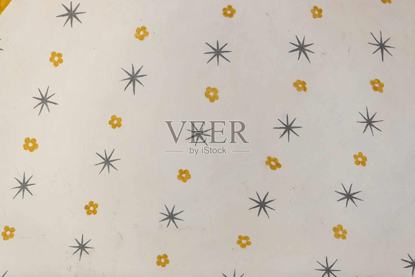 墙上的花卉和星星图案。照片摄影图片