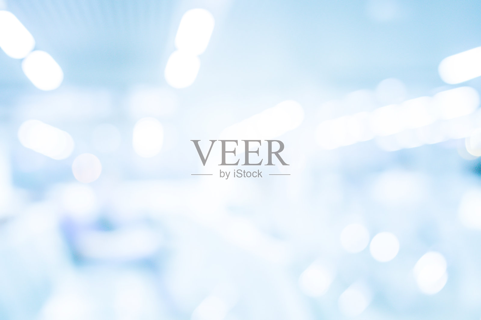 摘要对医院建筑内部的背景进行抽象模糊处理，用强光进行广告设计，展示内容概念照片摄影图片