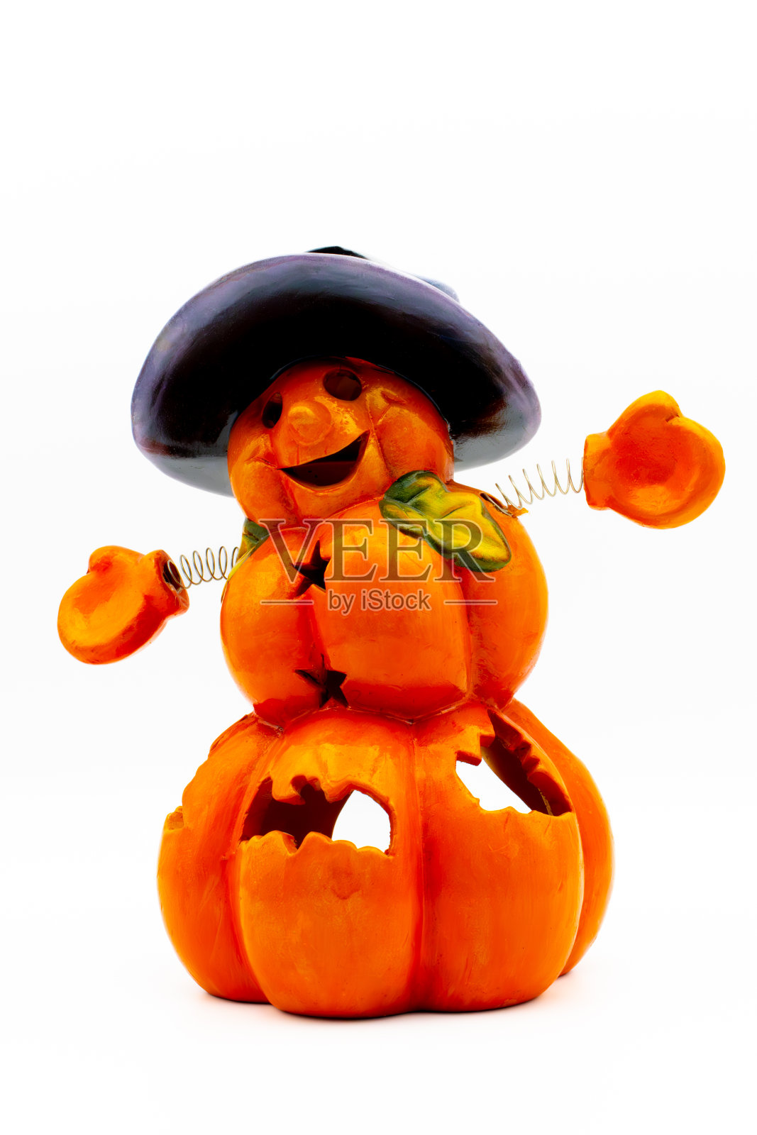 杰克灯笼小雕像孤立在白色的背景。万圣节南瓜形状的陶瓷烛台。照片摄影图片