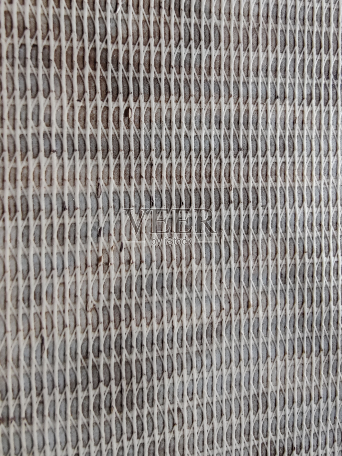 织物纹理背景。米色织物纹理近景。照片摄影图片