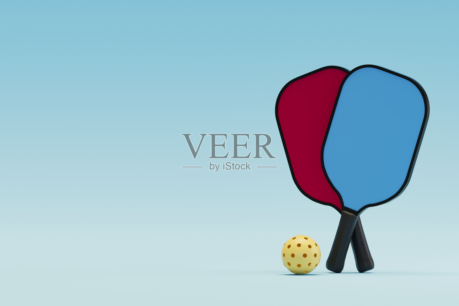 匹克球球拍和球在蓝色的背景照片摄影图片