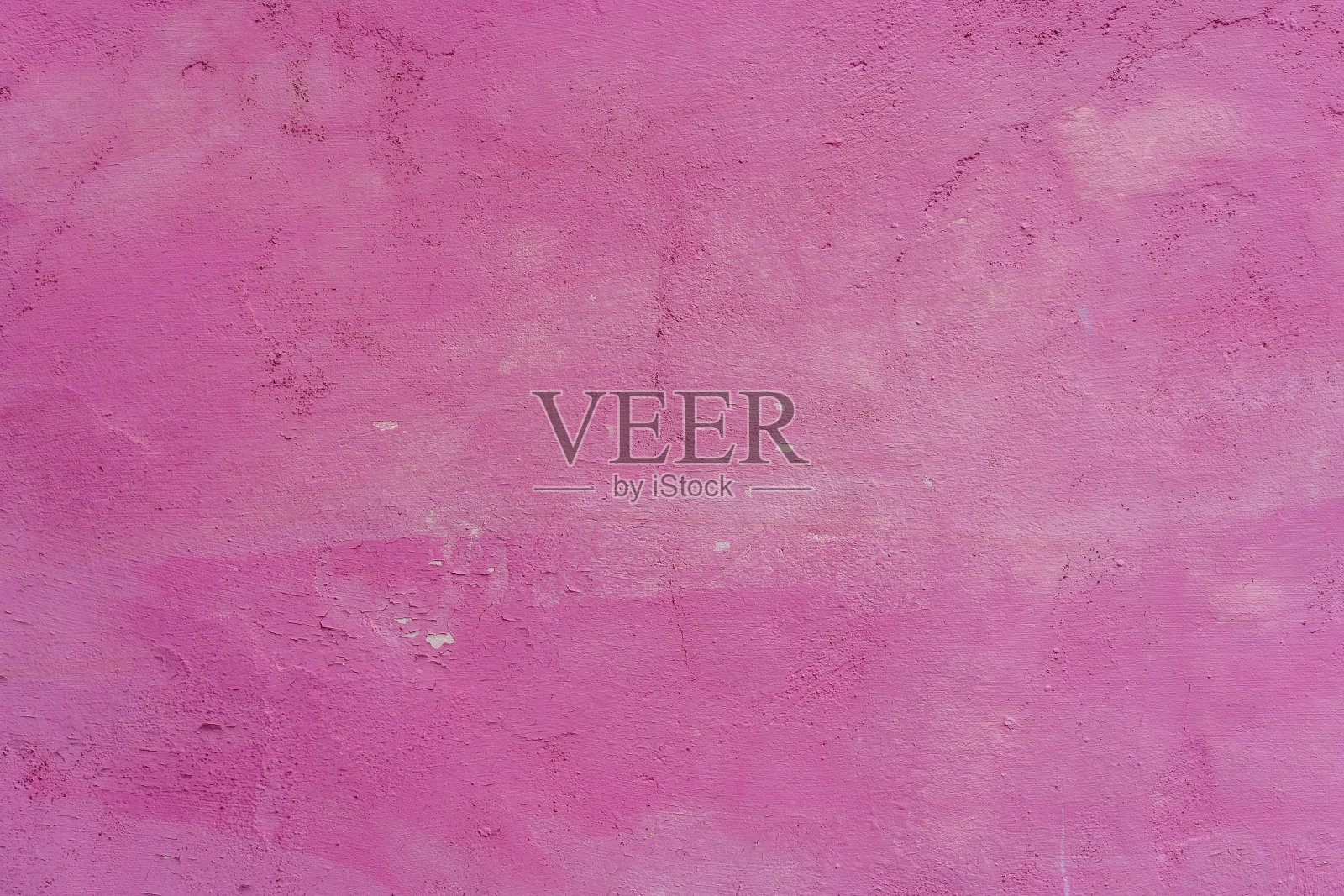 旧的破损墙面的背景或纹理呈粉红色照片摄影图片