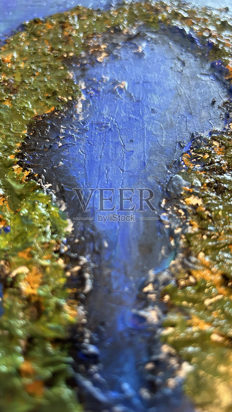 画布上的一幅画的特写。照片摄影图片