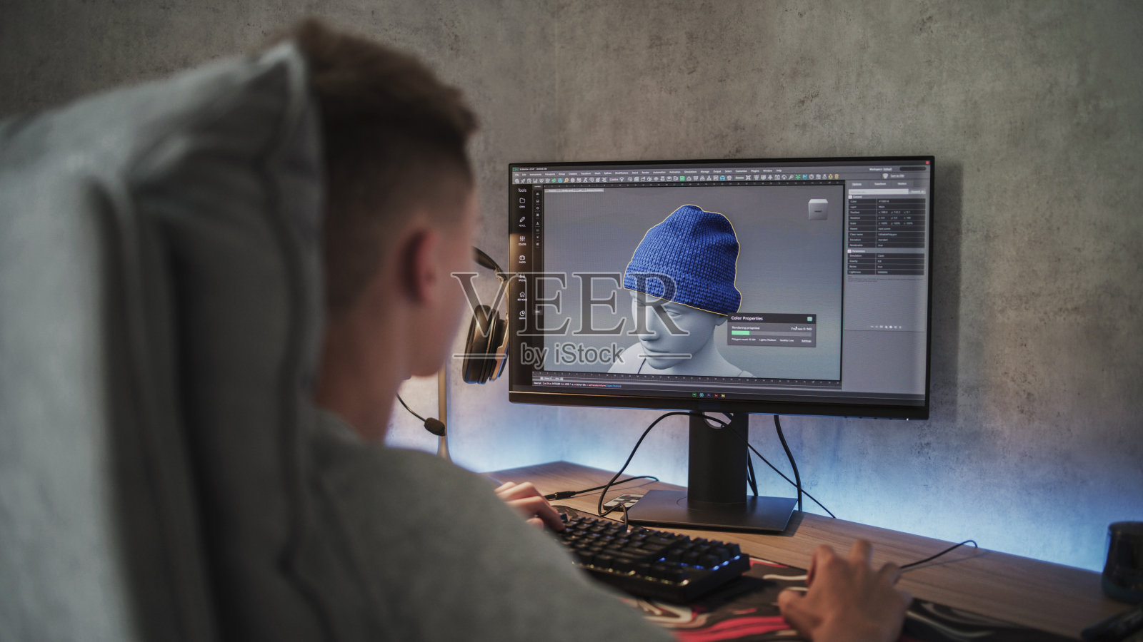 年轻的3D设计师使用PC创建和绘制衣服照片摄影图片