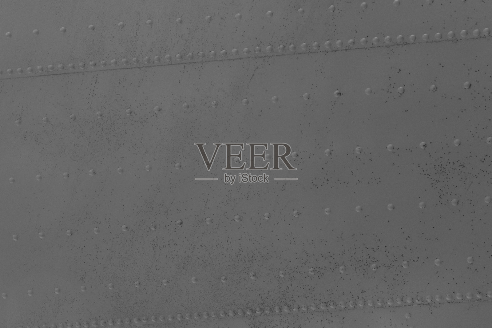 抽象钣金板背景与铆钉。照片摄影图片