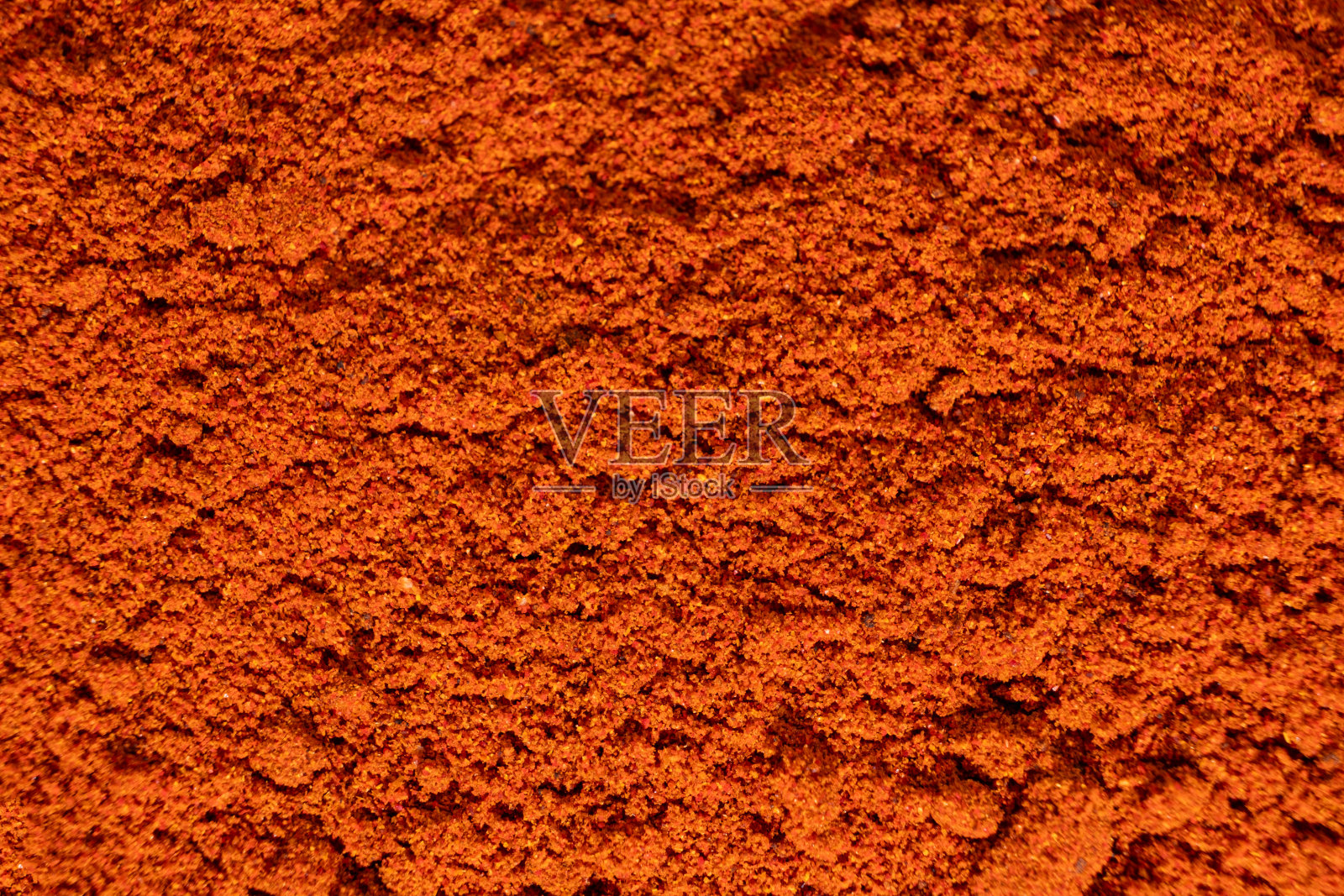 磨碎的辣椒粉，红色陶土香料背景，烹饪艺术。照片摄影图片