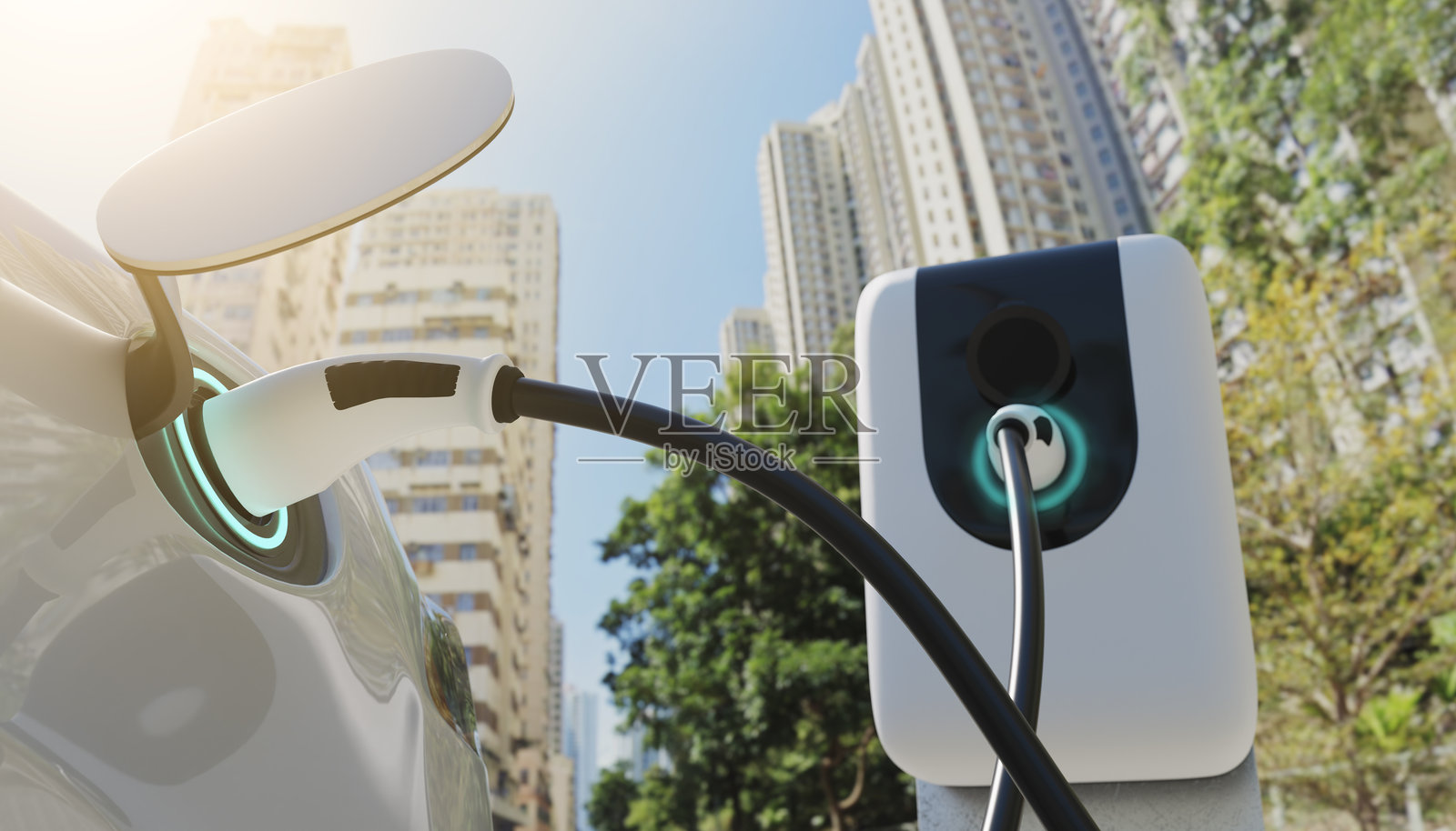 背景图片:在电站大楼充电的电动汽车。照片摄影图片