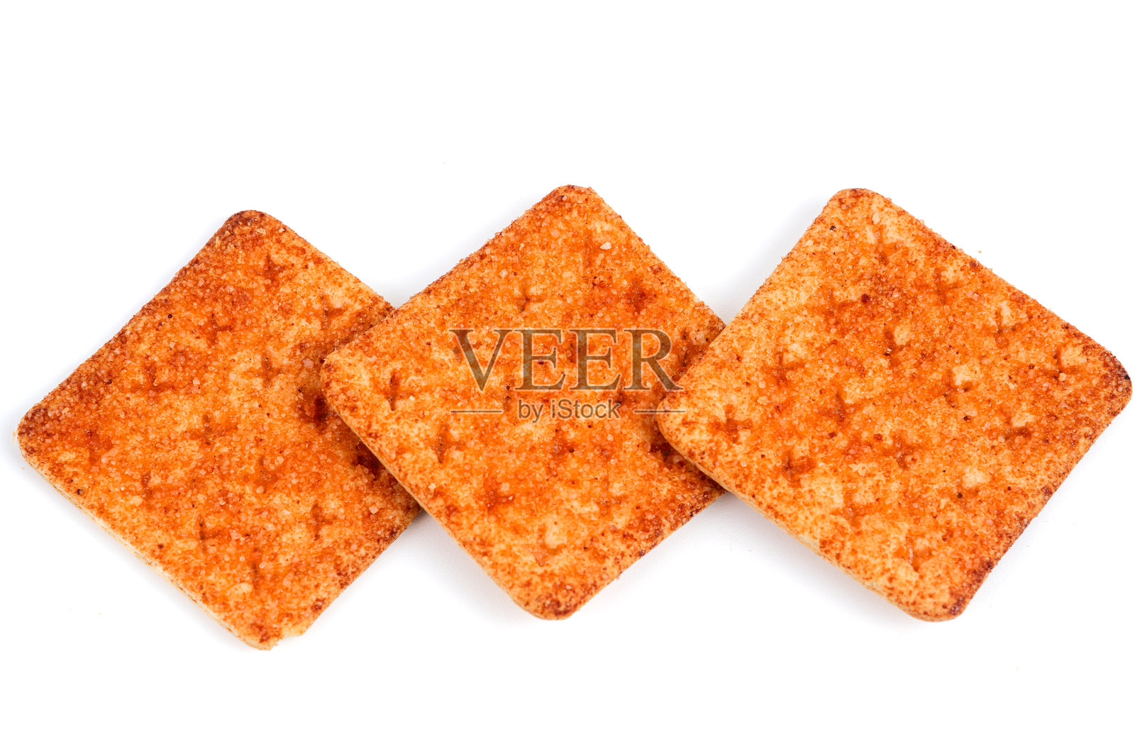 一堆牛肉松味的饼干。孤立在白色背景上。照片摄影图片