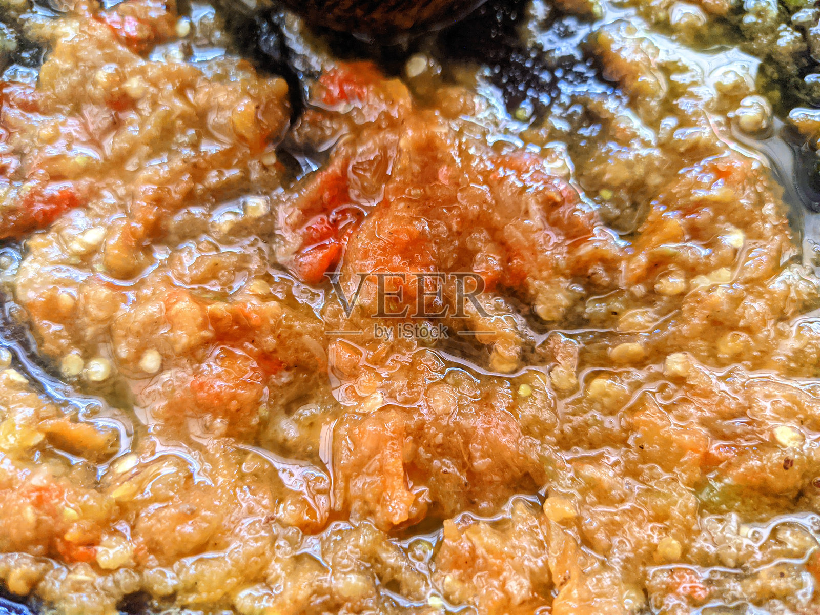 迫击炮里辣酱的特写照片摄影图片