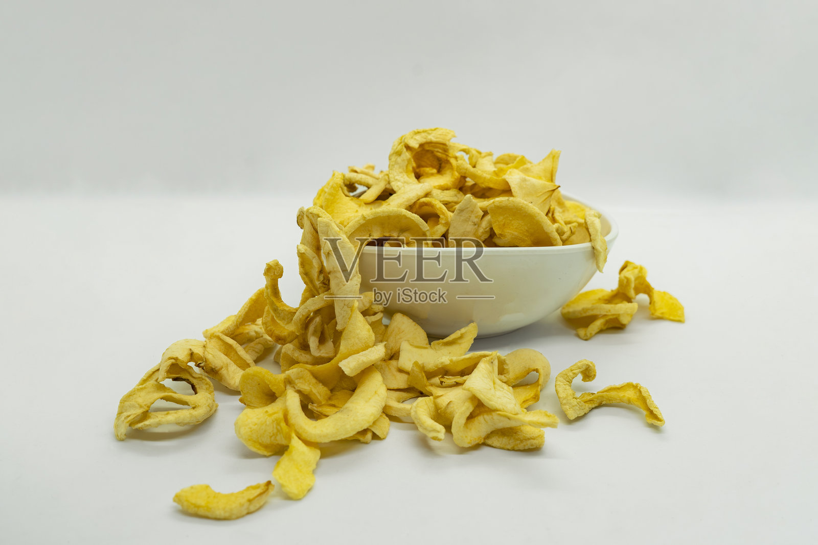 脱水美味看起来黄金干苹果健康干果野马马南苹果孤立的背景照片摄影图片