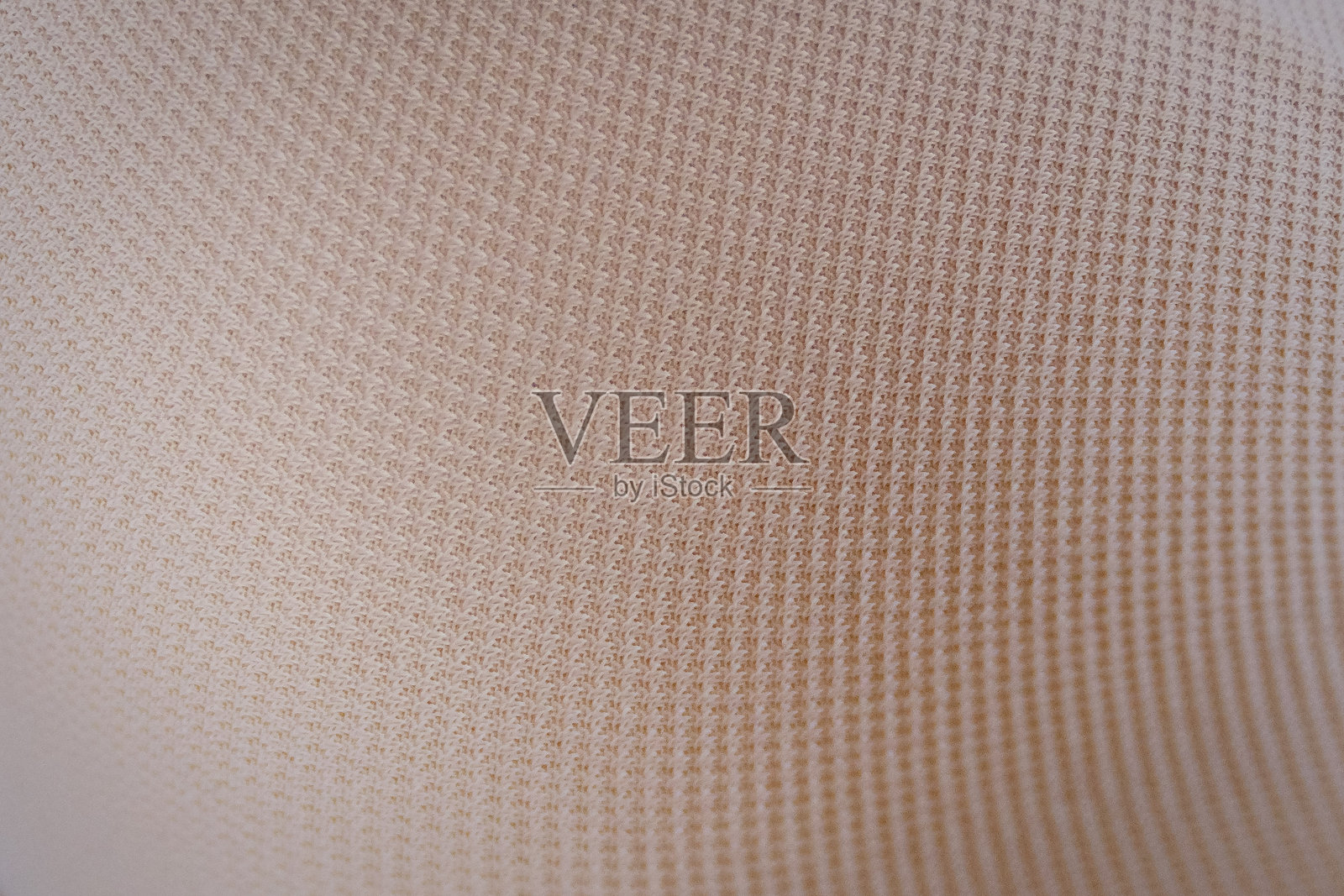 在白色背景的米色胸罩里，近距离观察照片摄影图片