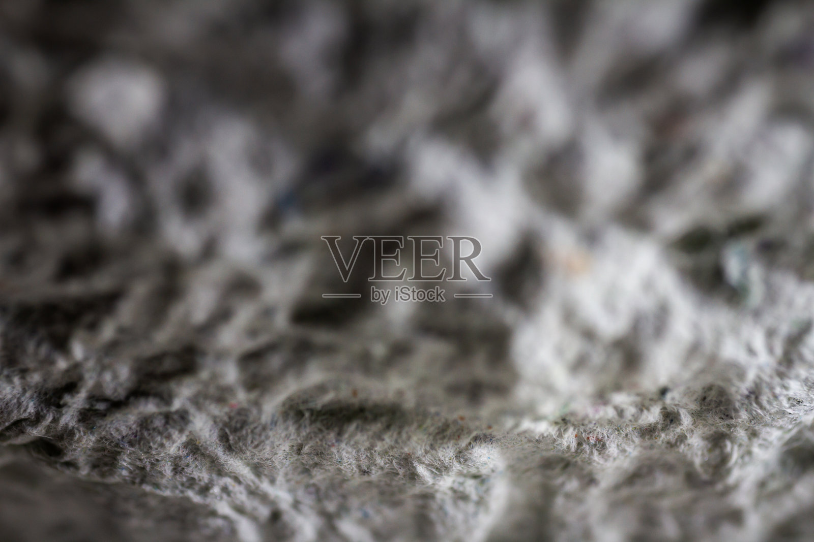 极近距离的旧灰色手工纸糊与结构和粗糙的纹理。照片摄影图片