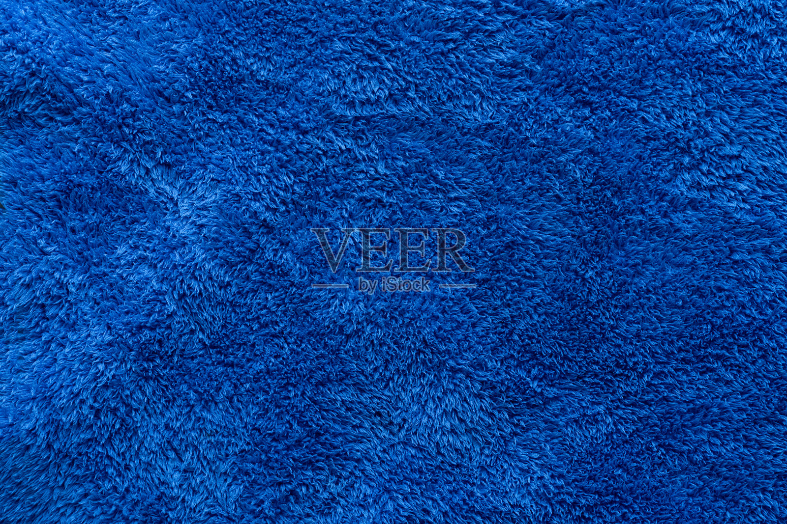 服装面料蓝色超细纤维纹理背景，贴近织物表面抽象的织物。照片摄影图片