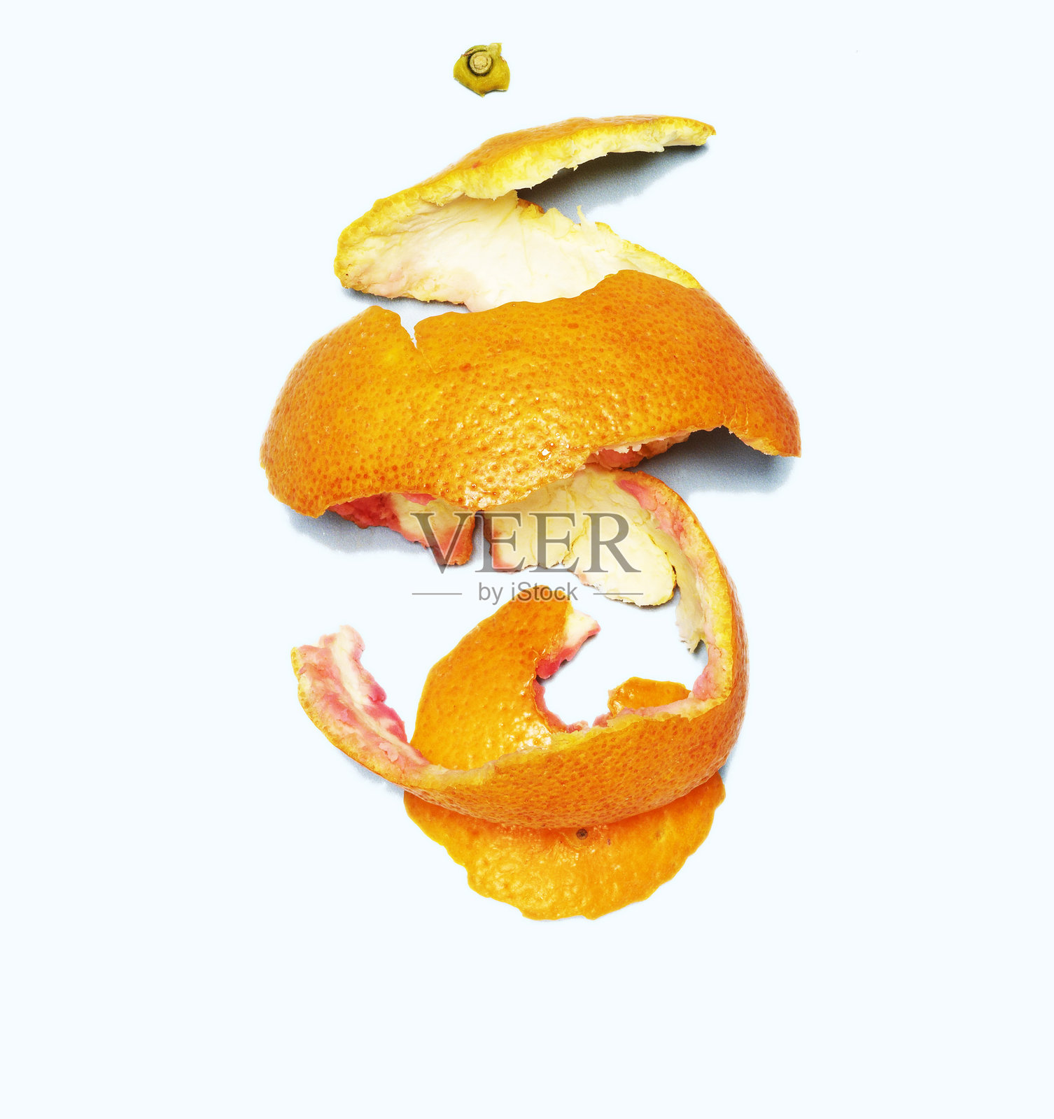 橙色果皮在白色背景上的特写照片摄影图片