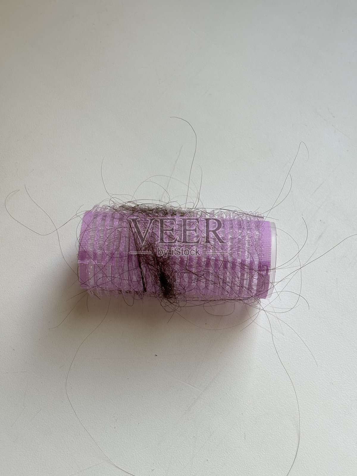 小直径卷发器上掉毛照片摄影图片