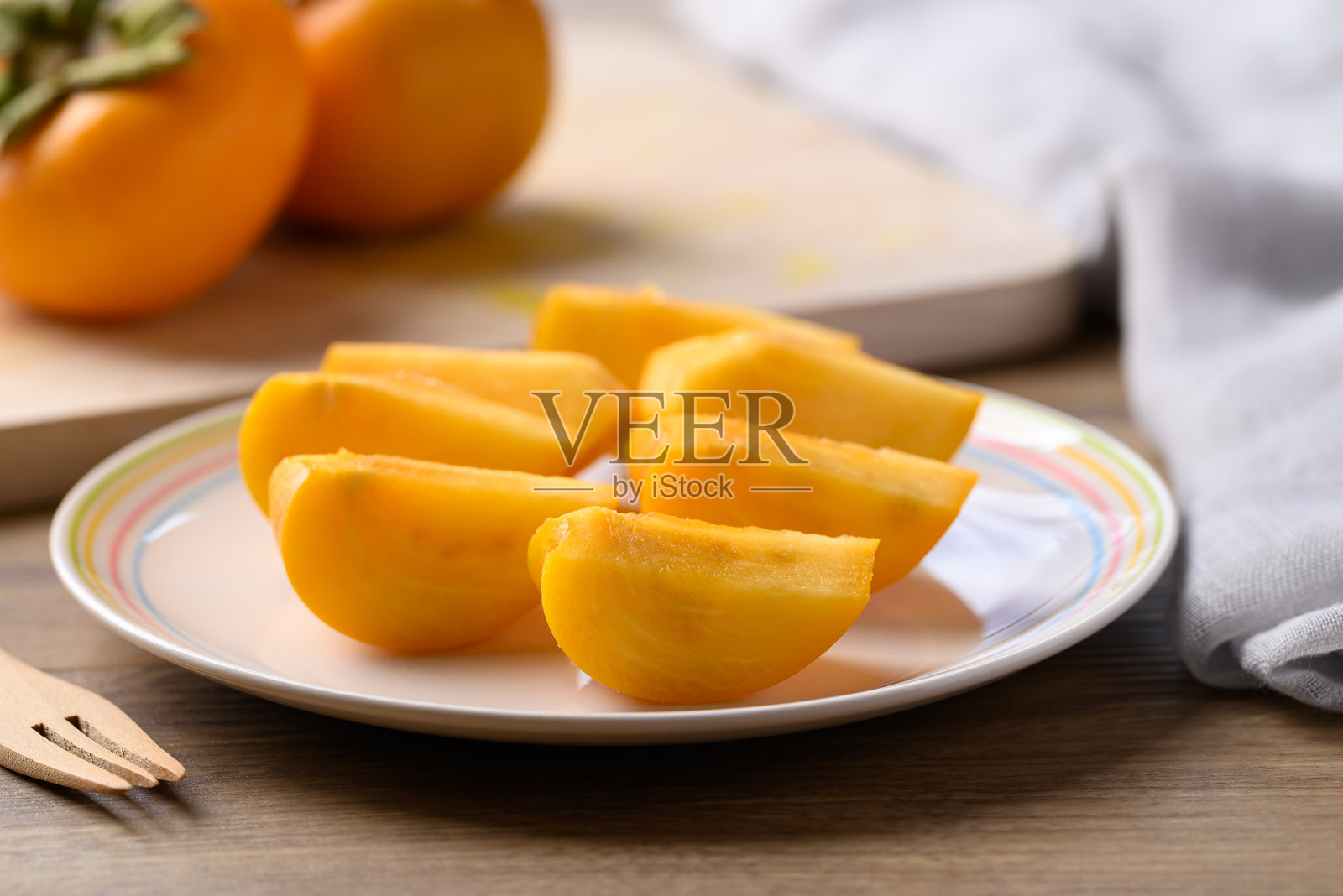 熟柿子切片即食，秋果照片摄影图片