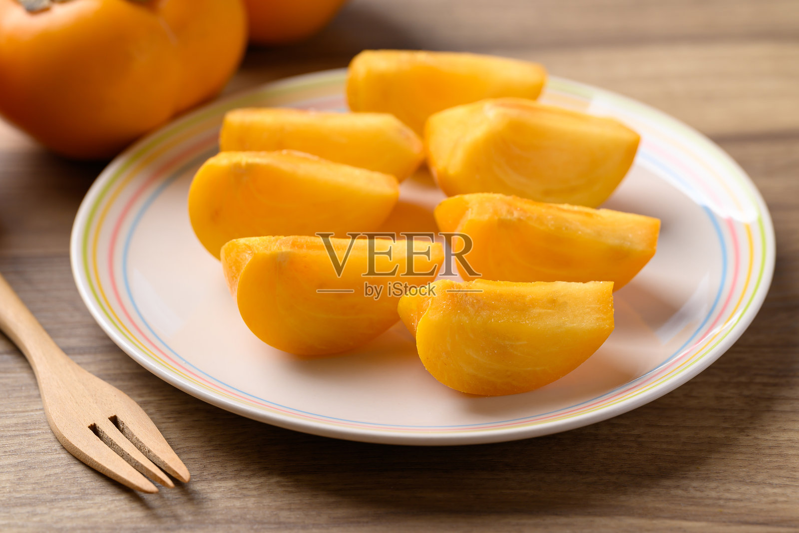 熟柿子切片即食，秋果照片摄影图片