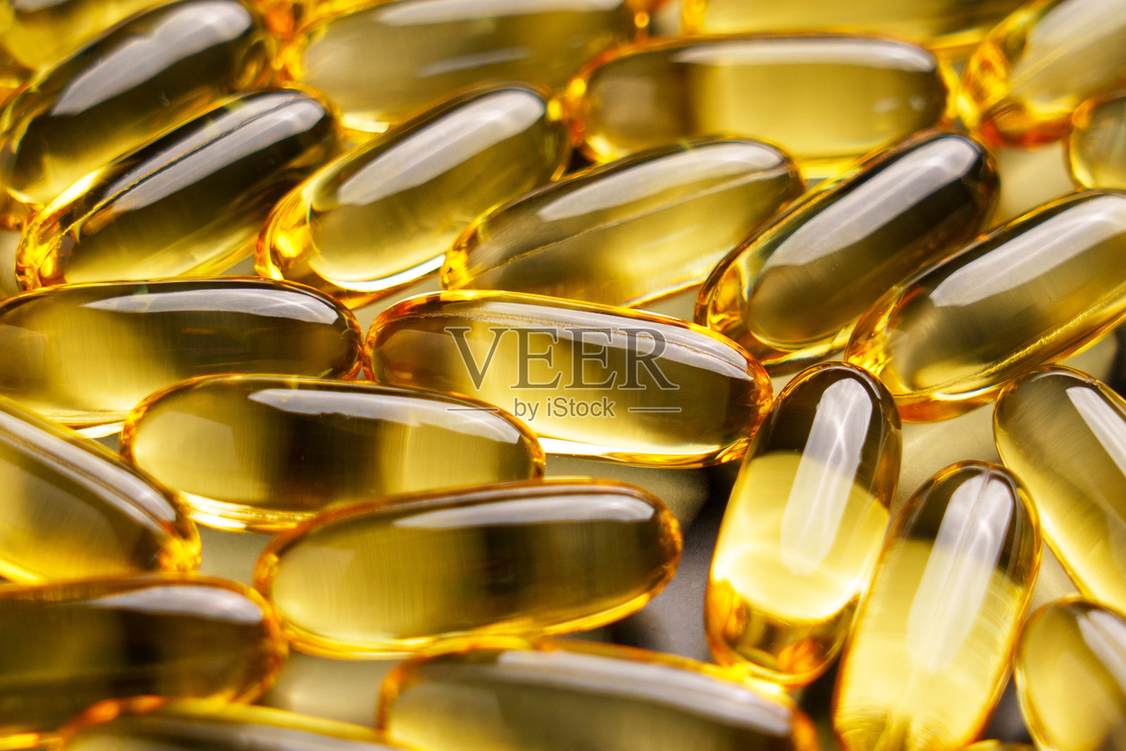 黄色软半透明欧米茄3脂肪酸胶囊关闭照片摄影图片