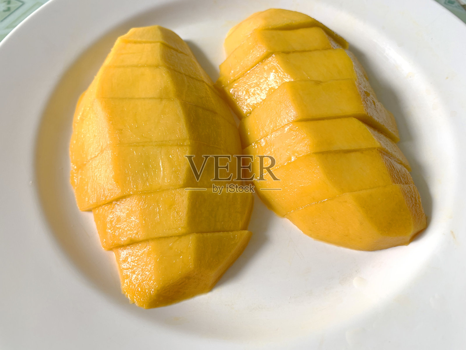 盘子里的芒果照片摄影图片
