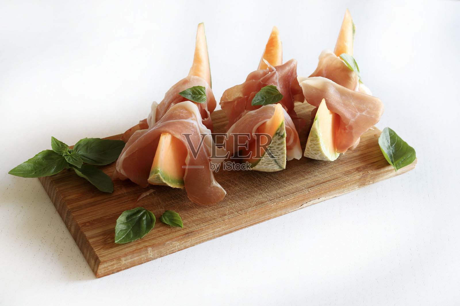 火腿和甜瓜。照片摄影图片